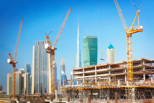 Urban construction site with cranes and structural frames