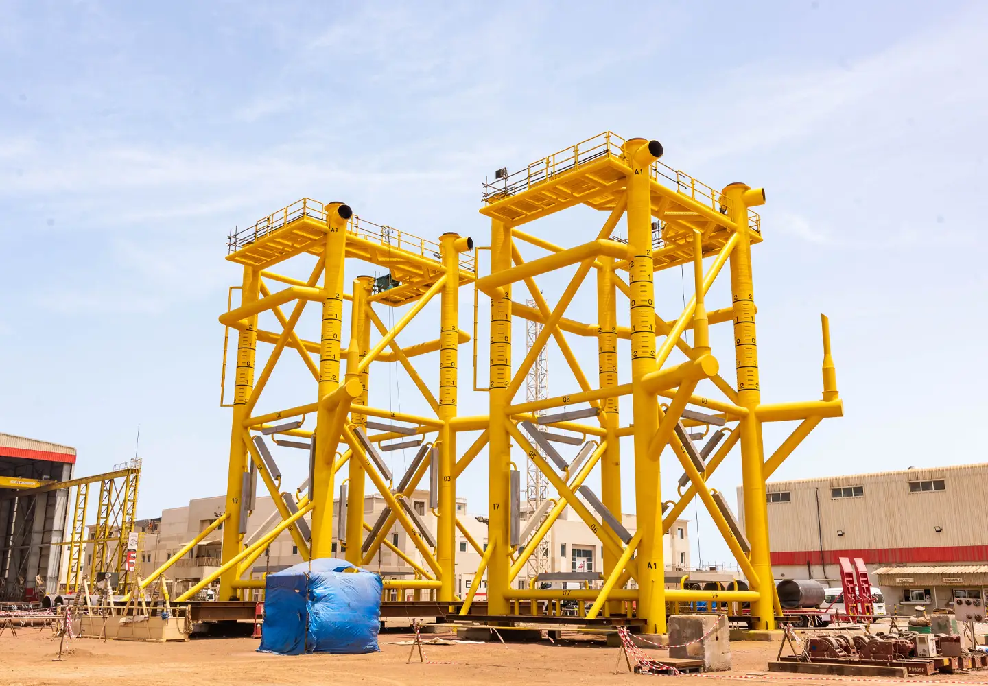Yellow industrial steel infrastructure representing the upcoming Lamprell Precast Infrastructure project