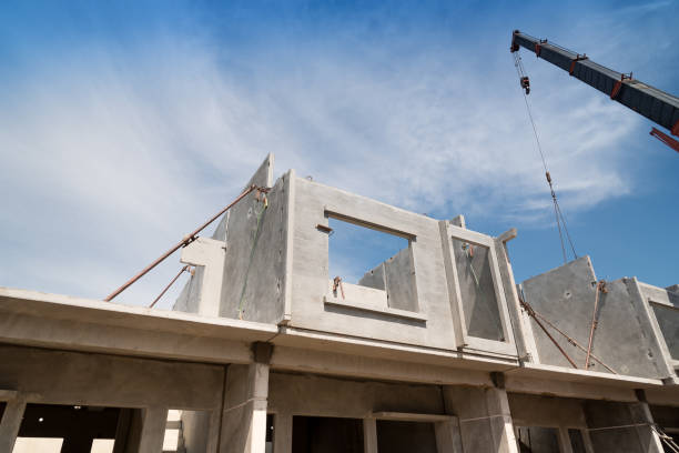 Precast wall panels being positioned during site installation