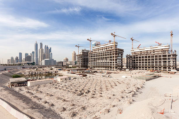 Large development site with multiple structures and cranes